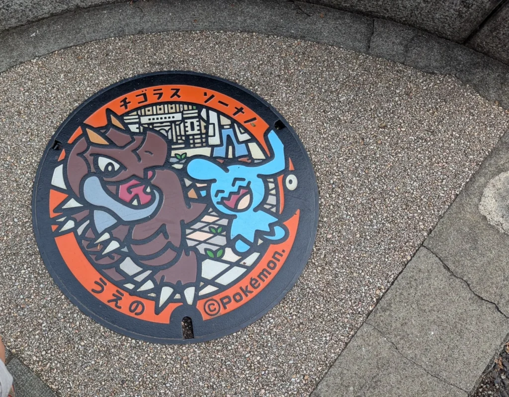 Pokémon manhole (Poké Lid) in Ueno featuring Tyrunt and Wynaut
